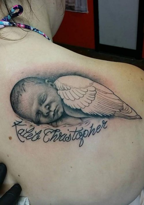 Sleeping Baby Angel Tattoo With Name On Girls Right Back Shoulder